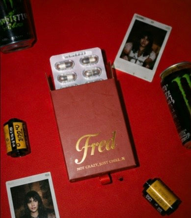 Fred box open with capsules